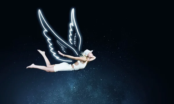 Angel girl flying high — Stock Photo, Image
