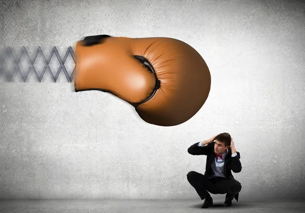 Businessman attacked by glove — Stock Photo, Image