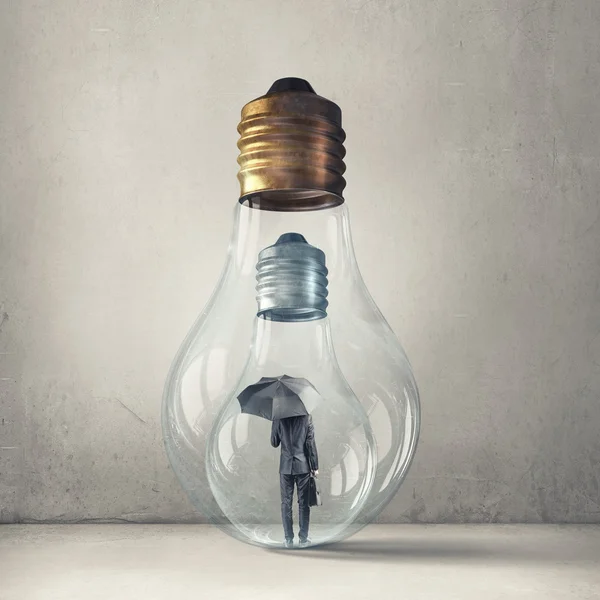 Man inside of glass bulb — Stock Photo, Image
