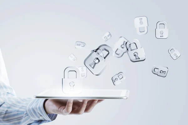 Tablet in hand with symbols — Stock Photo, Image