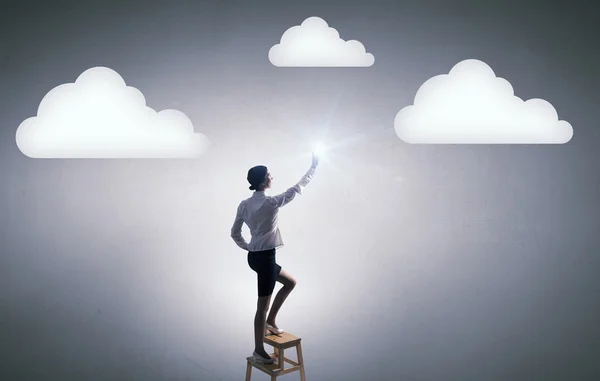 Woman touch cloud — Stock Photo, Image