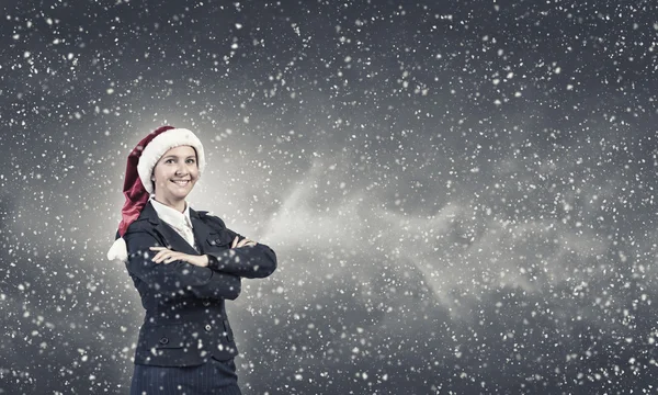 Femme d'affaires en chapeau de Père Noël — Photo