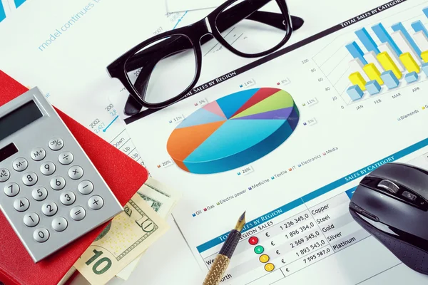 Financial charts and graphs on the table — Stock Photo, Image