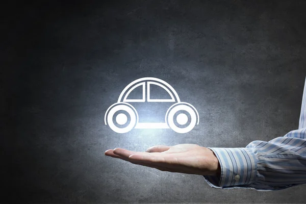 Car symbol in hand — Stock Photo, Image