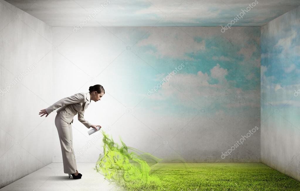 Woman spray grass