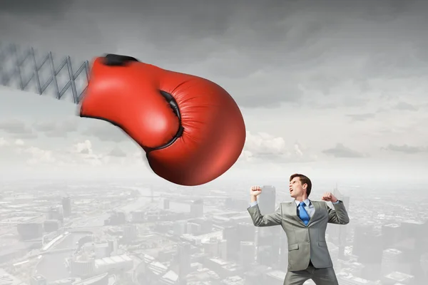 Businessman attacked by glove — Stock Photo, Image