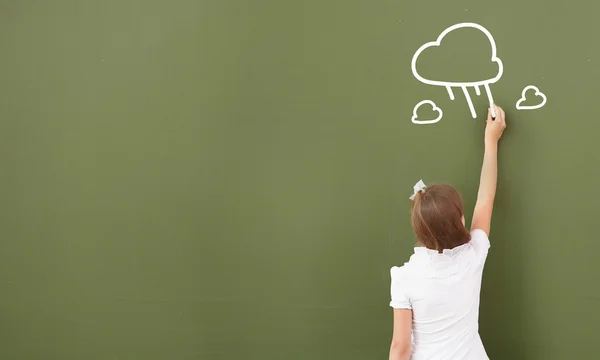 School girl at blackboard — Stock Photo, Image