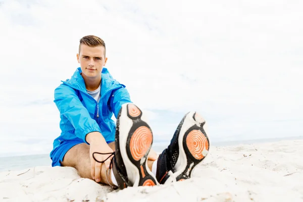 Man training on beach outside Royalty Free Stock Images