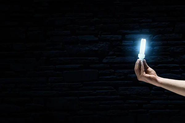 Bright bulb in darkness — Stock Photo, Image