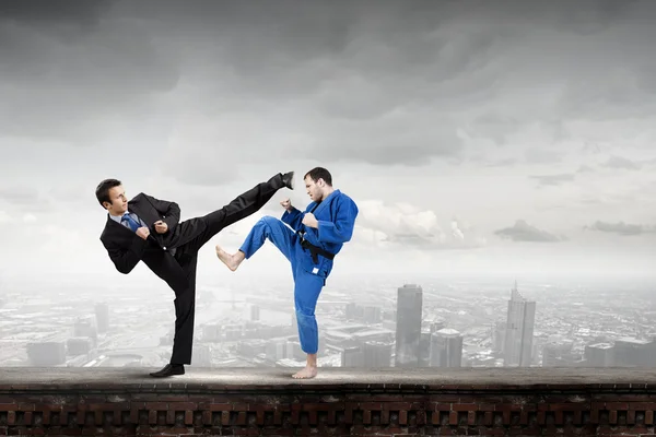 Karate man in blue kimino — Stock Photo, Image