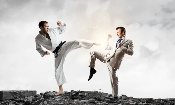 Karate man in white kimino — Stock Photo, Image