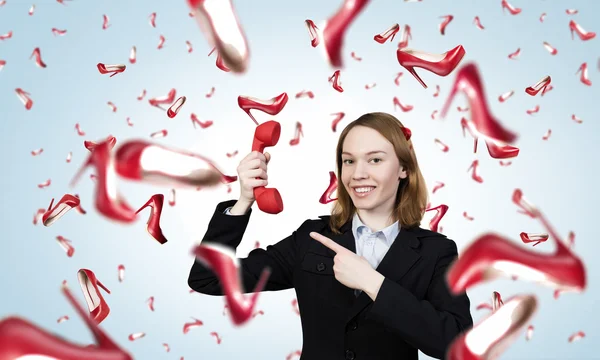 Vrouw met rode handset — Stockfoto