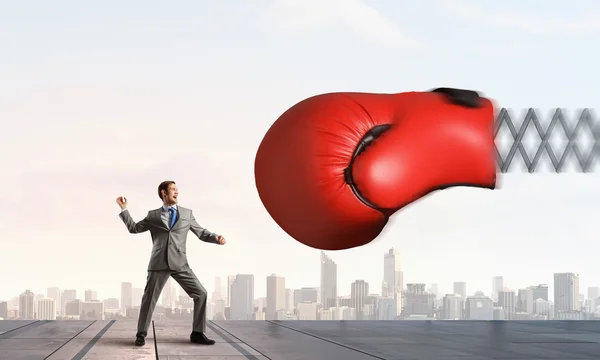 Businessman attacked by glove — Stock Photo, Image