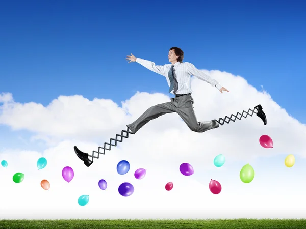 Businessman making wide jump — Stock Photo, Image