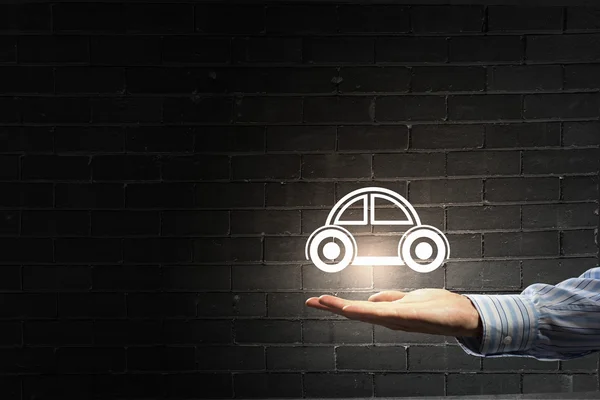 Car symbol in hand — Stock Photo, Image