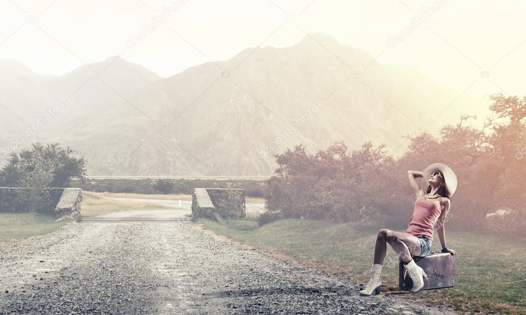 Pretty brunette retro hitchhiker