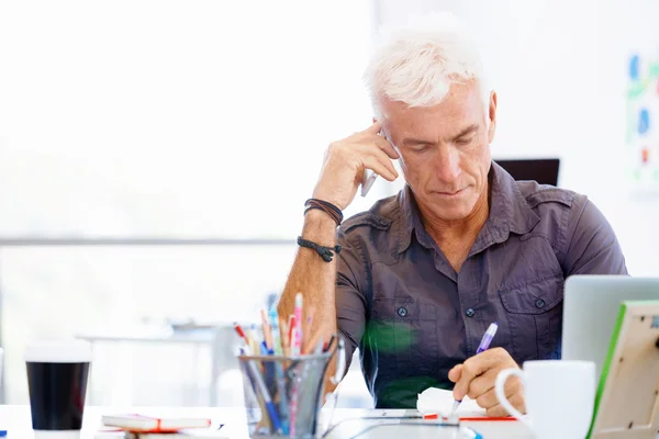 Handsome businessman in office — Stock Photo, Image