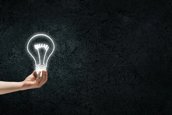 Great bright idea in darkness — Stock Photo, Image
