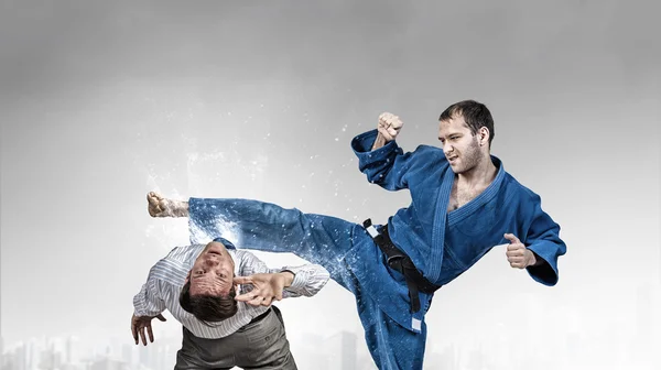 Karate man in blue kimino — Stock Photo, Image