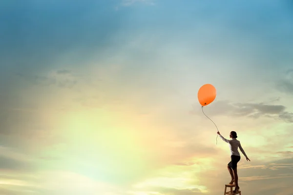 Woman reaching hand up — Stock Photo, Image