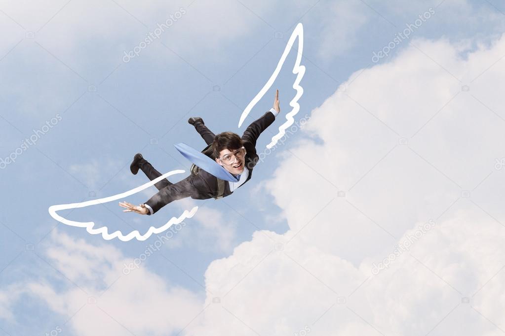 Businessman flying high