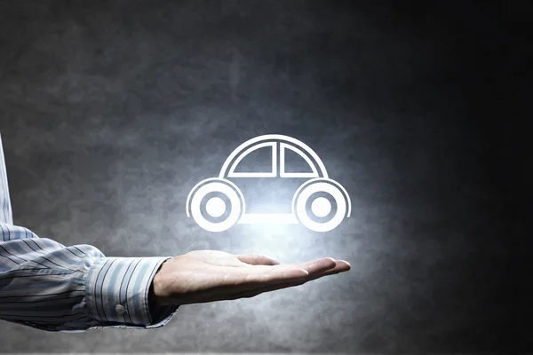 Car symbol in hand — Stock Photo, Image