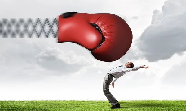 Businessman attacked by glove — Stock Photo, Image