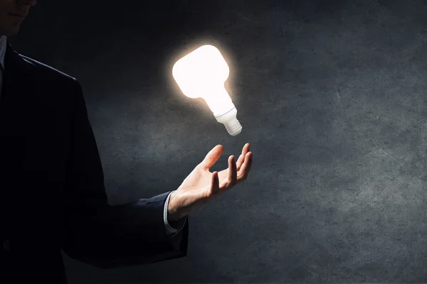 Bright idea in hand — Stock Photo, Image