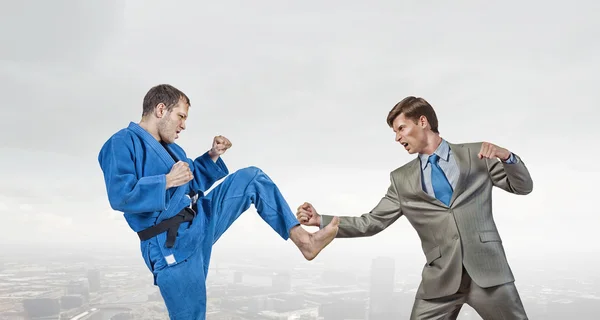 Karate man in blue kimino — Stock Photo, Image