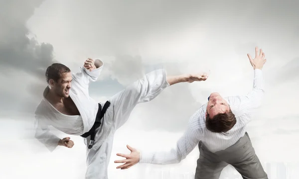 Karate man in white kimino — Stock Photo, Image