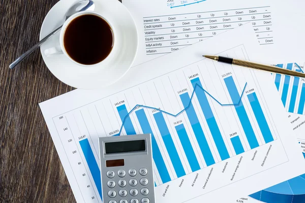 Financial charts and graphs on the table — Stock Photo, Image