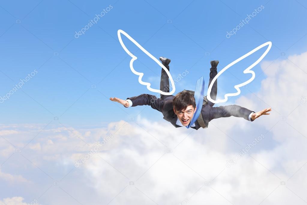 Businessman flying high