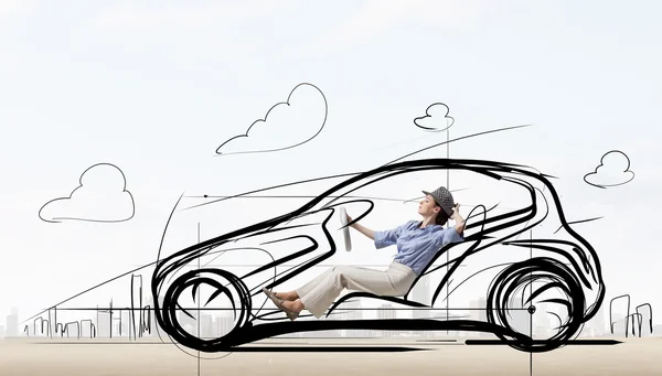 Woman in drawn car — Stock Photo, Image