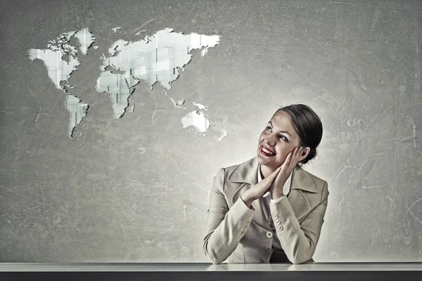 Attractive businesswoman sitting at table — Stock Photo, Image