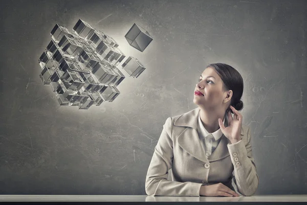 Attractive businesswoman sitting at table — Stock Photo, Image