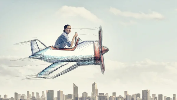 Woman in drawn airplane — Stock Photo, Image