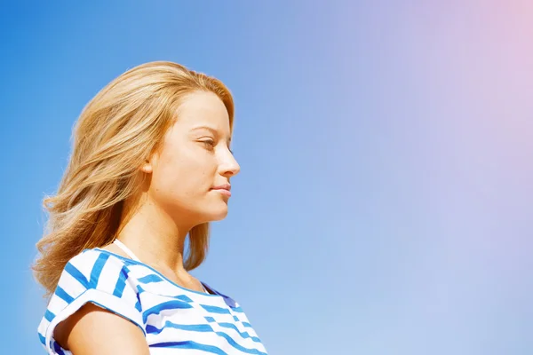 Young woman relaxing on the beach Stock Image