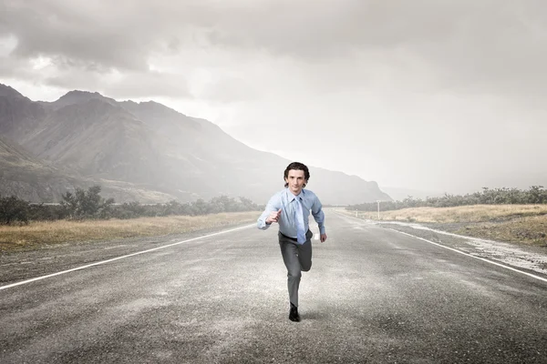 Businessman run on road — Stock Photo, Image