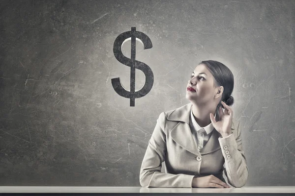 Attractive businesswoman sitting at table — Stock Photo, Image