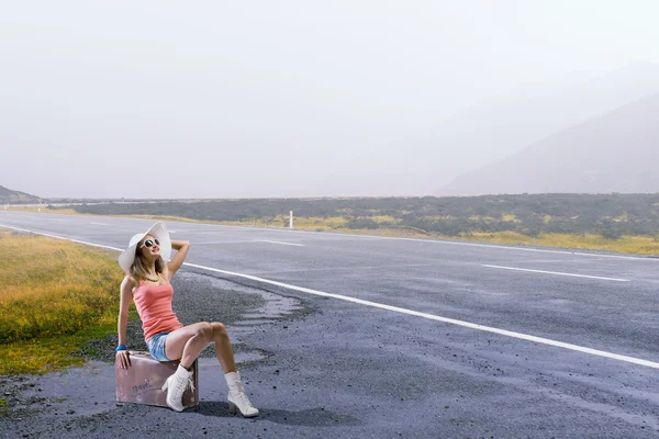 Pretty brunette retro hitchhiker