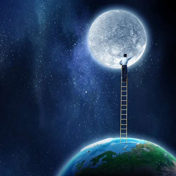 Man reaching moon planet — Stock Photo, Image