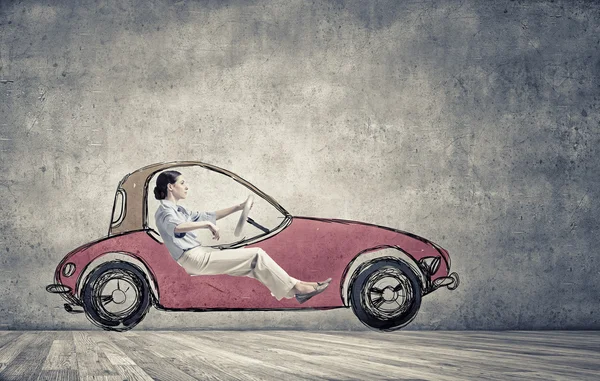 Woman in drawn car — Stock Photo, Image