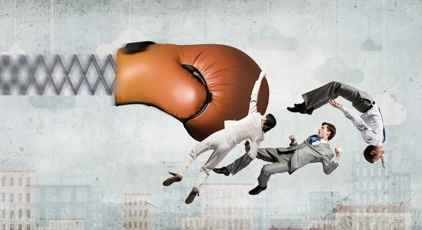 Businesspeople fighting with boxing glove — Stock Photo, Image