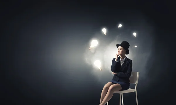 Girl in black cylinder — Stock Photo, Image