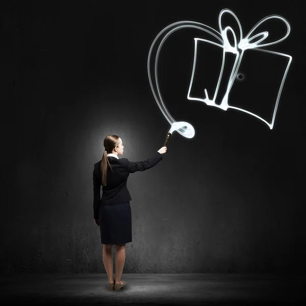 Woman drawing with lantern light — Stock Photo, Image