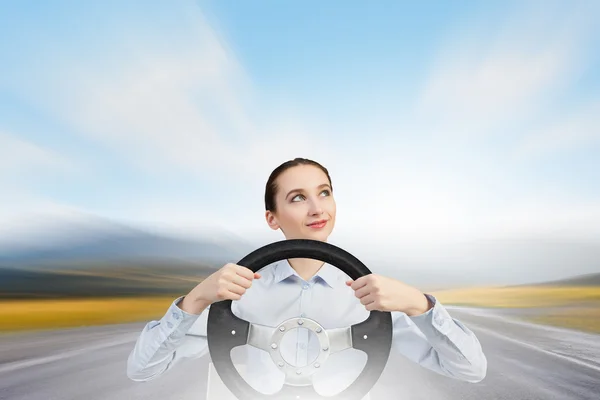 Woman with steering wheel — Stock Photo, Image