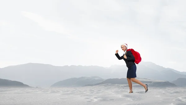 Santa woman with sack — Stock Photo, Image