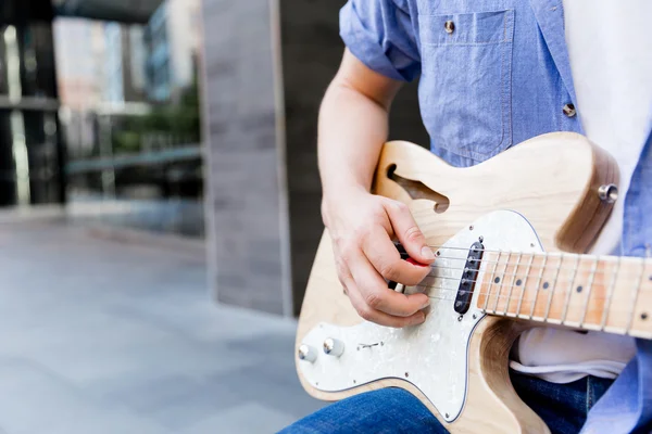 Hands of musician with guitar — Stock Photo, Image