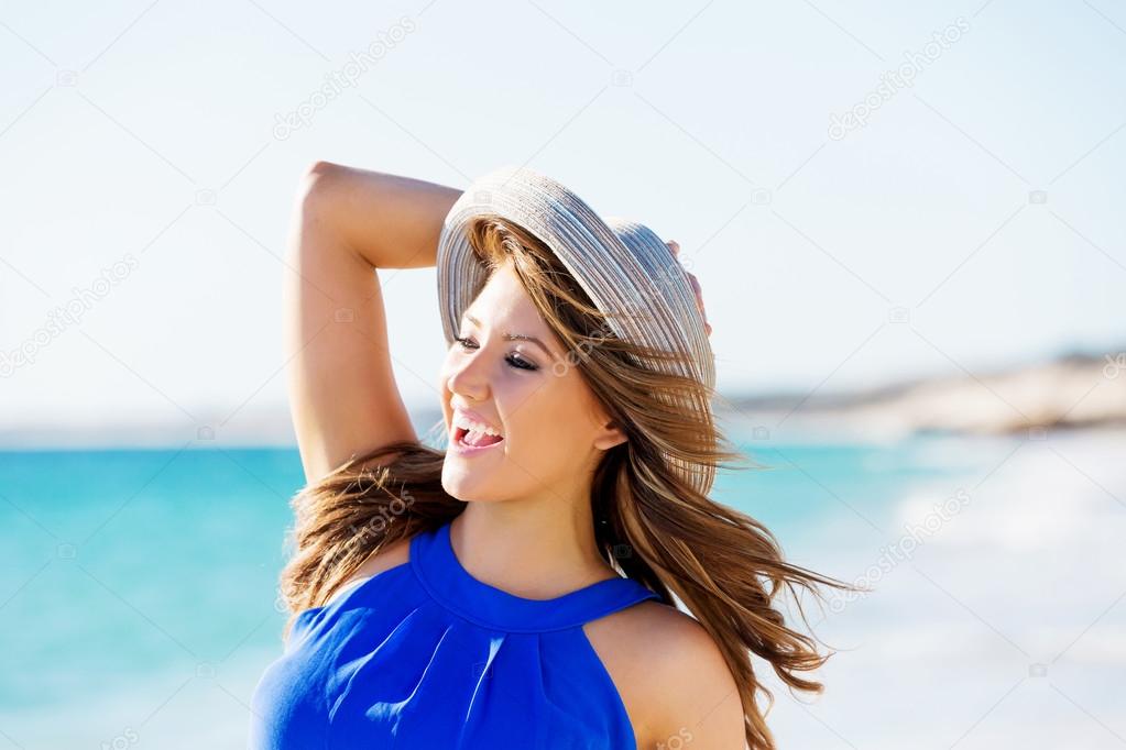 Young woman walking along the beach