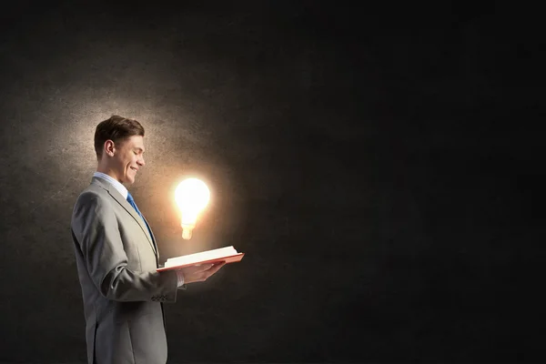 Businessman with book in hands — Stock Photo, Image